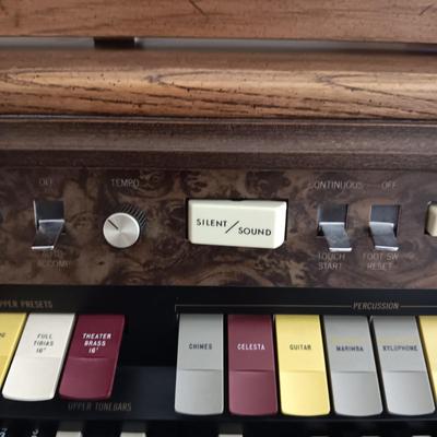 HAMMOND ORGAN WITH ALL THE BELLS AND WHISTLES, PIANO LIGHT AND A BENCH PLUS A LOT OF SHEET MUSIC
