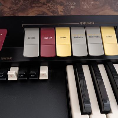 HAMMOND ORGAN WITH ALL THE BELLS AND WHISTLES, PIANO LIGHT AND A BENCH PLUS A LOT OF SHEET MUSIC