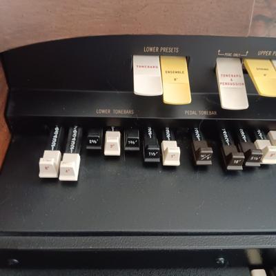 HAMMOND ORGAN WITH ALL THE BELLS AND WHISTLES, PIANO LIGHT AND A BENCH PLUS A LOT OF SHEET MUSIC