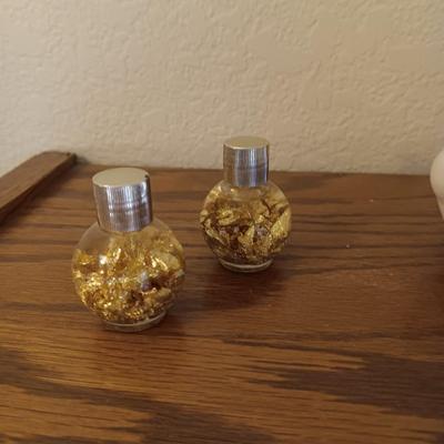 A POLAR BEAR AND ESKIMO MADE WITH ALASKA PORCELAIN AND GOLD FLAKES AND COASTERS