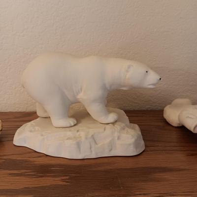 A POLAR BEAR AND ESKIMO MADE WITH ALASKA PORCELAIN AND GOLD FLAKES AND COASTERS