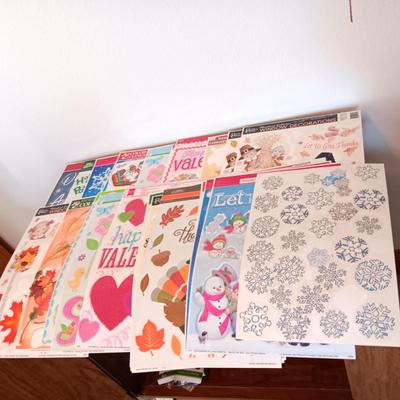A LARGE GROUP OF VARIOUS WINDOW CLINGS