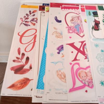 A LARGE GROUP OF VARIOUS WINDOW CLINGS