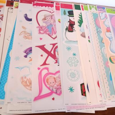 A LARGE GROUP OF VARIOUS WINDOW CLINGS