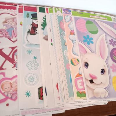 A LARGE GROUP OF VARIOUS WINDOW CLINGS