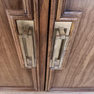 2 DOOR CABINET FILLED WITH PLACEMATS AND A LAMP WITH A DIMMER SWITCH