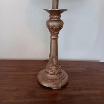 2 DOOR CABINET FILLED WITH PLACEMATS AND A LAMP WITH A DIMMER SWITCH