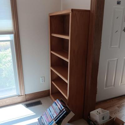 WOODEN BOOKSHELF WITH SOME BOOKS ON RELIGION