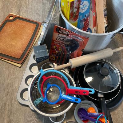 Miscellaneous kitchen pots pans, strainers, cutting boards