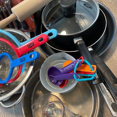 Miscellaneous kitchen pots pans, strainers, cutting boards