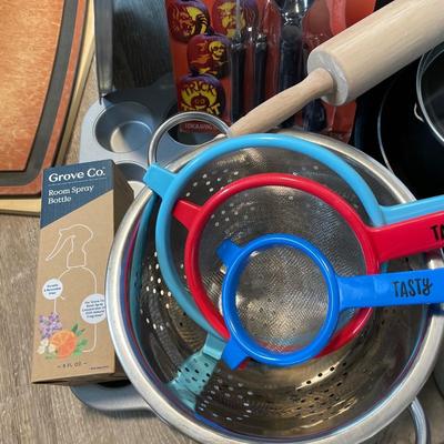 Miscellaneous kitchen pots pans, strainers, cutting boards
