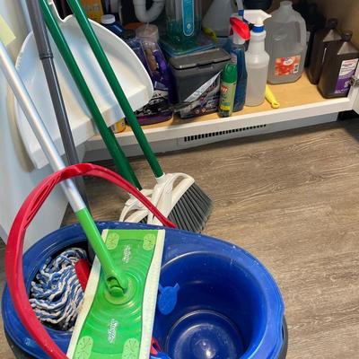 Cleaning supplies, bucket, and brooms