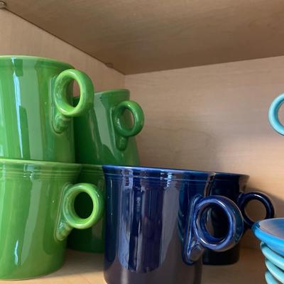 Fiesta mugs, cups, and saucers and other glassware