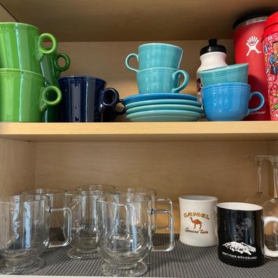 Fiesta mugs, cups, and saucers and other glassware