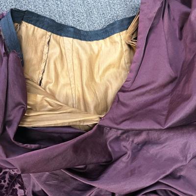 Sale Photo Thumbnail #287: This two piece Burgundy Floral Patterned Velvet and silk dress is very fragile and some seams have opened up.  There is a loose piece that we are unsure of where or how it is attached (side? back? - see photos).  No maker label.  Unsure of size - see phot