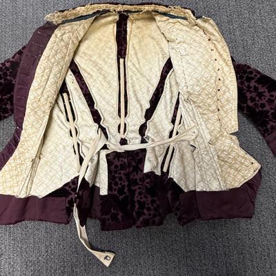 Sale Photo Thumbnail #280: This two piece Burgundy Floral Patterned Velvet and silk dress is very fragile and some seams have opened up.  There is a loose piece that we are unsure of where or how it is attached (side? back? - see photos).  No maker label.  Unsure of size - see phot