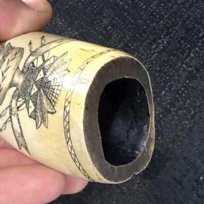 E11-Images on whale tooth replica