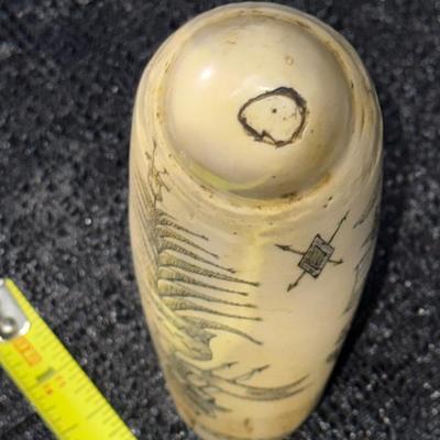 E11-Images on whale tooth replica