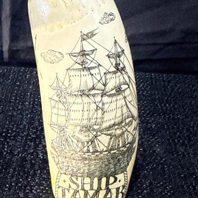 E11-Images on whale tooth replica