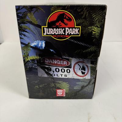 LOT 95: Hasbro Jurassic Park/ Transformers Crossover Toy