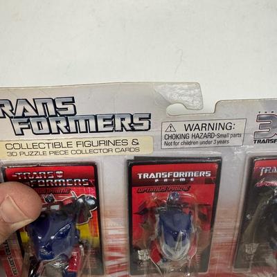 LOT 102: Transformers Variety Package: Funko Pop, Lunch Box and Various Toys