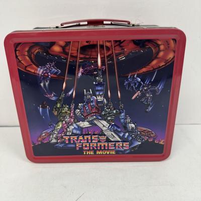 LOT 102: Transformers Variety Package: Funko Pop, Lunch Box and Various Toys