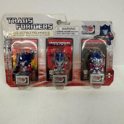 LOT 102: Transformers Variety Package: Funko Pop, Lunch Box and Various Toys
