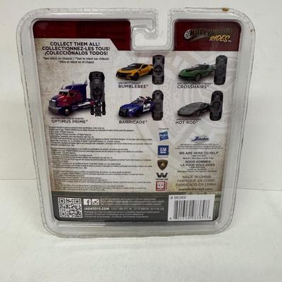 LOT 102: Transformers Variety Package: Funko Pop, Lunch Box and Various Toys