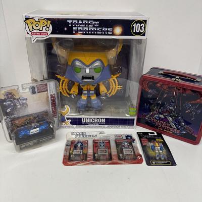 LOT 102: Transformers Variety Package: Funko Pop, Lunch Box and Various Toys