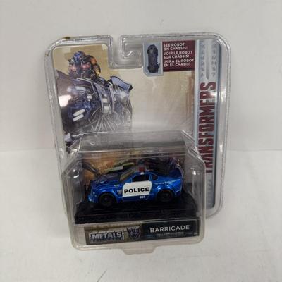 LOT 102: Transformers Variety Package: Funko Pop, Lunch Box and Various Toys