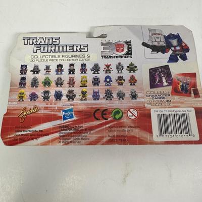 LOT 102: Transformers Variety Package: Funko Pop, Lunch Box and Various Toys