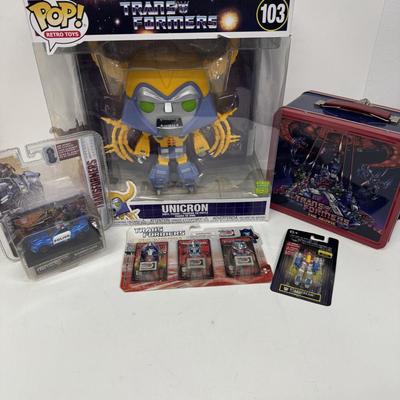 LOT 102: Transformers Variety Package: Funko Pop, Lunch Box and Various Toys