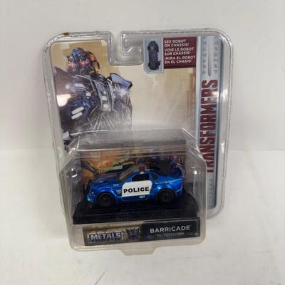 LOT 102: Transformers Variety Package: Funko Pop, Lunch Box and Various Toys