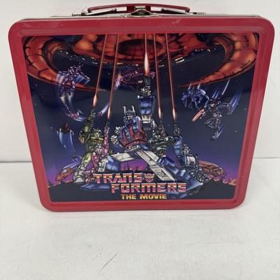 LOT 102: Transformers Variety Package: Funko Pop, Lunch Box and Various Toys
