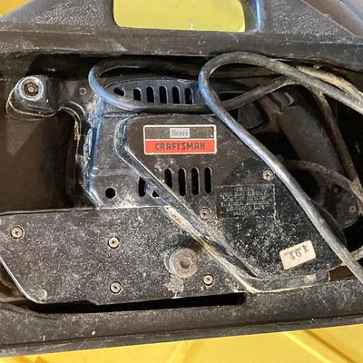 LOT 111: Craftsman Three Inch Belt Sander with Carry Case, Black & Decker Electric Orbital Sander, Chicago Electric Angle Grinder