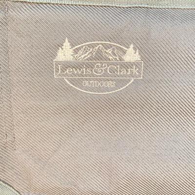 LOT 115: Outdoor Livin’ Includes and Lewis & Clark Fold & Go Directors Chair, Tiki Torches, Cooler, Copper Plated Bottle Holder...