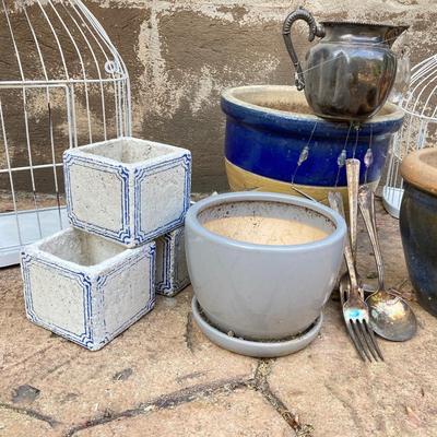 LOT 121: Home Decor Collection - Ceramic / Pottery Planters, Silver Plated Pitcher and Utensil Wind Chimes, Two White Wire Bird Cages and...