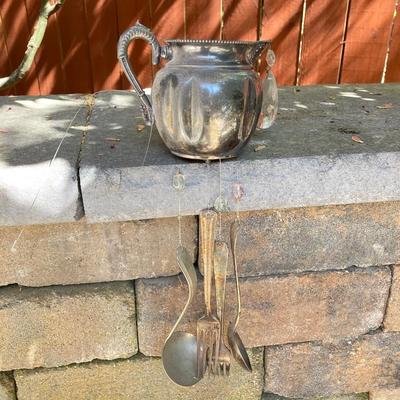 LOT 121: Home Decor Collection - Ceramic / Pottery Planters, Silver Plated Pitcher and Utensil Wind Chimes, Two White Wire Bird Cages and...