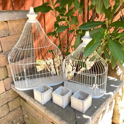 LOT 121: Home Decor Collection - Ceramic / Pottery Planters, Silver Plated Pitcher and Utensil Wind Chimes, Two White Wire Bird Cages and...