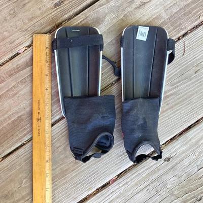 LOT 126: Nok Champion Hockey by Carrom Wooden Board, Bladerunner Adult Ice Skates, Children's Ice Skates / Adidas Shin Guards and...