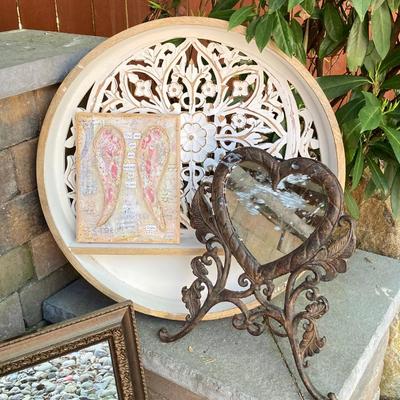 LOT 128: Home Decor Collection - Carved Circular Shelf, Wall Mirror, Heart Shaped Metal Table Mirror and Inspirational Artwork