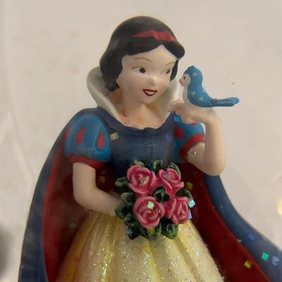 LOT 141: Disney Princesses - Snow White Snow Globe Music Box with Cinderella, Sleeping Beauty, Bell and The Little Mermaid