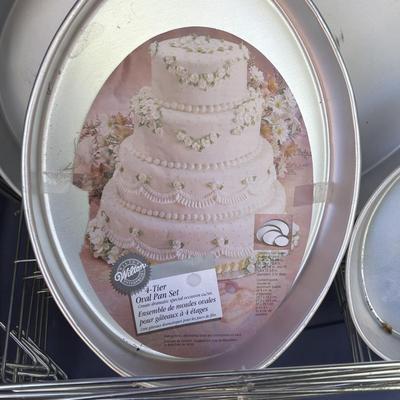 LOT 188: Wilton Cake Pans, Wooden Crated, Rubbermaid Tote & More