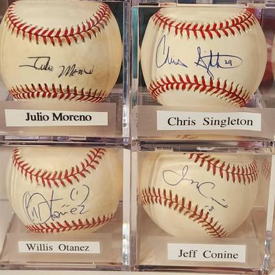 Lot of 4 OMLB Signed Autographed BaseballsJulio Moreno, Chis Singleton, Willis Otanez, Jeff Conine