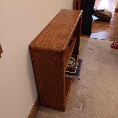 WOODEN BOOKSHELF WITH BOOKS AND DECOR