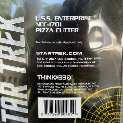 LOT 14P: Star Trek Collectibles - 1997 Calendar, U.S.S. Enterprise NCC-1701 Pizza Cutter & More
