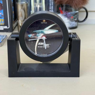 LOT 14P: Star Trek Collectibles - 1997 Calendar, U.S.S. Enterprise NCC-1701 Pizza Cutter & More