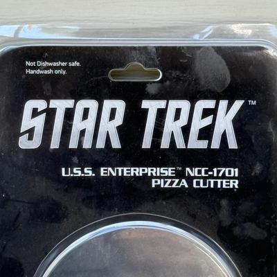 LOT 14P: Star Trek Collectibles - 1997 Calendar, U.S.S. Enterprise NCC-1701 Pizza Cutter & More