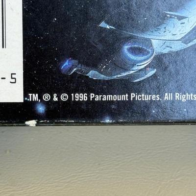 LOT 14P: Star Trek Collectibles - 1997 Calendar, U.S.S. Enterprise NCC-1701 Pizza Cutter & More