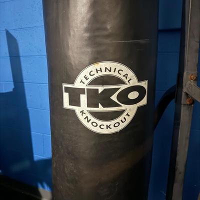LOT 86: TKO Commercial Heavy Bag Stand w/ TKO 100lb Pro Style Heavy Bag